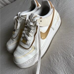 Nike White and Gold Sneakers women’s Air Force one shadow